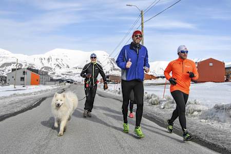Participants perform during the Wings for Life World Run in App Run in Spitzbergen, Norway on May 7, 2017.