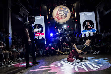 Salah shows a backbend move on the floor in Paris, France.