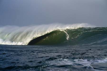 Conor Maguire surfs a 60ft wave on the coast of Ireland.