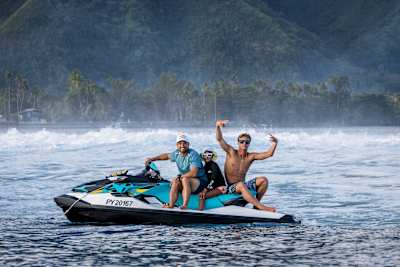 Kauli Vaast and Michel Bourez ride a Red Bull jetski in Tahiti on May 30, 2022. 
