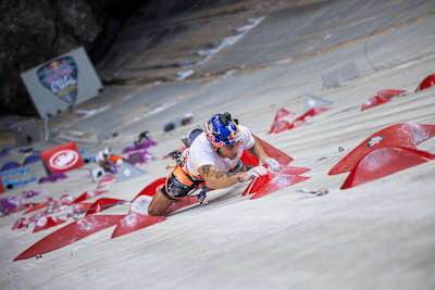In 2024, Alberto Gines López scales the towering Verzasca Dam during Red Bull's Dual Ascent competition in Switzerland