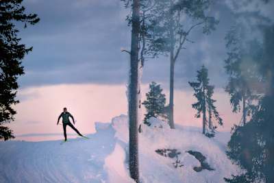 Linn Svahn cross-country skiing in winter terrain during a dynamic photo shoot in snowy Sweden on January 9, 2024.