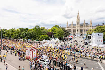 Thousands of participants at the 2024 Wings for Life World Run in Vienna, Austria run to raise funds for spinal cord research, embodying Red Bull’s spirit of determination and global solidarity