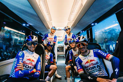 In 2026, Red Bull – BORA – hansgrohe riders including Remco Evenepoel and Florian Lipowitz prepare inside the team bus ahead of Stage 7 at the 105th Volta a Catalunya in Barcelona, Spain