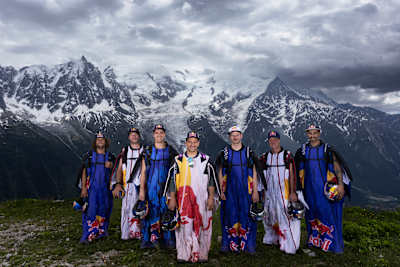 On June 6, 2026, the Red Bull Skydive Team, including Fred Fugen and Dani Roman, pose before the breathtaking Mont Blanc for the epic Mont Blanc Formation in France