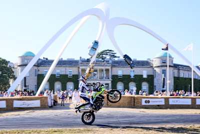 Sam Sunderland performs a thrilling wheelie on the Triumph Tiger 900 Rally Pro at the 2026 Goodwood Festival of Speed in Chichester, England