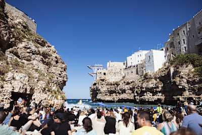 Lisa Faulkner of the USA dives from the 22-metre platform during the 2026 Red Bull Cliff Diving World Series in Polignano a Mare, Italy