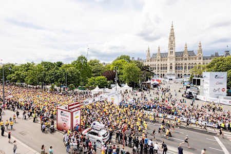 Thousands of participants at the 2024 Wings for Life World Run in Vienna, Austria run to raise funds for spinal cord research, embodying Red Bull’s spirit of determination and global solidarity