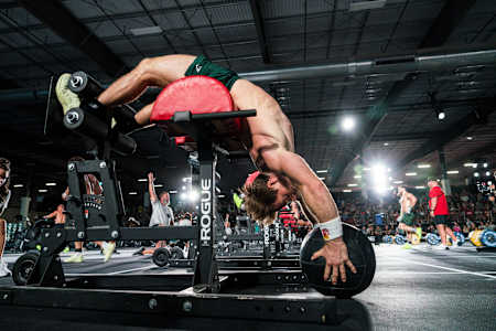 Noah Ohlsen competes at the World Fitness Project performing a challenging core exercise.