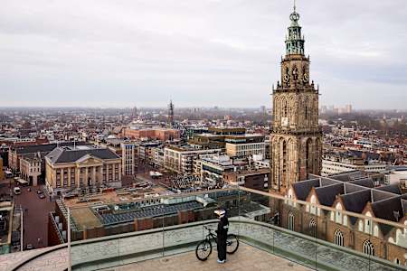 Patricia Druwen surveys Groningen from above with her bike, scouting prime locations for Red Bull District Ride 2026 in the heart of the Dutch city.