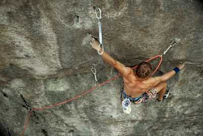Alexander Megos in action on a rock face in Switzerland.
