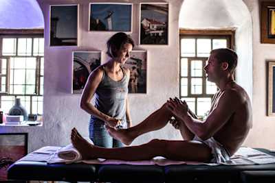 Physiotherapist Angela Passenbrunner with Constantin Popovici during the Red Bull Cliff Diving World Series in Mostar, Bosnia and Herzegovina on September 6, 2018. 