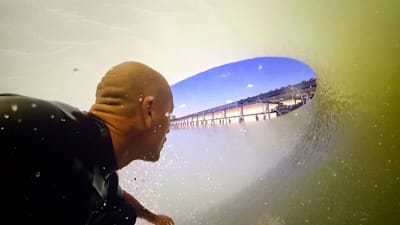 Kelly Slater rides the tube in Lemoore, California