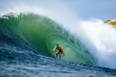 Stephanie Gilmore rides the tube at Honolua Bay in Maui