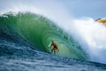 Stephanie Gilmore rides the tube at Honolua Bay in Maui