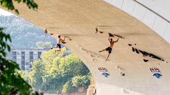 On August 16, 2025, Darius Râpă and Mikel Linacisoro tackle the dramatic under-bridge route at Red Bull Creepers in Chattanooga, Tennessee, showing fearless climbing and Red Bull adventure