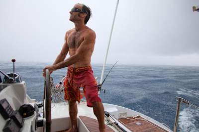 Gavin McClurg at the helm of his catamaran.