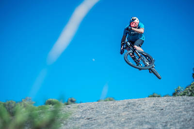MTB rider David Cachon gets air whilst riding on the El Caminito del Rey near Malaga, Spain