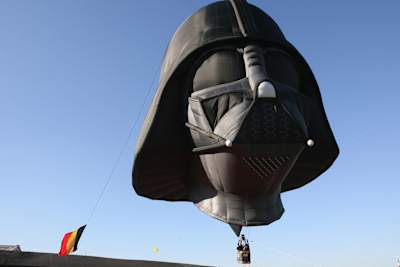 A hot air balloon in the shape of Darth Vader from the Star Wars is inflated at the Tours and Taxis site as part of the Star W