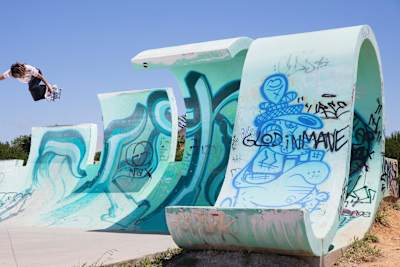 Nora Vasconcellos does a Backside Air in Portugal.