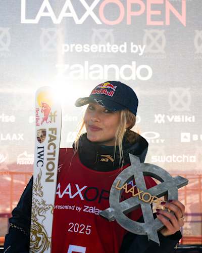 China's Eileen Gu posing with Laax Open trophy in 2025 - she won the freeski slopestyle event 