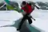 Stefan Glowacz leaps over a river of ice water