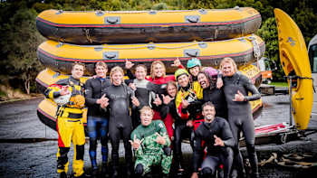 Jamie O’Brien, Poopies, Zen, Alex Hayes, Choco, Lucas Godfrey, Skummy, Max Bourne and Phil pose for a photo after river rafting in Rotorua, New Zealand on May 31, 2019.