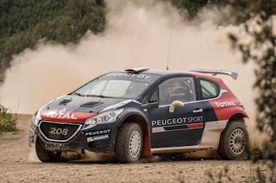 Carlos Sainz drives a Peugeot 208 T16