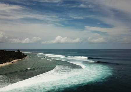 Empty waves peel off in the Mentawai Islands.