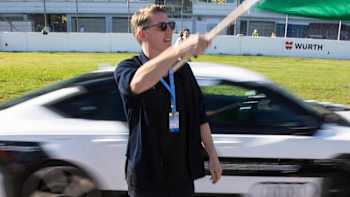 German World Cup-winning footballer Bastian Schweinsteiger signals the start of Audi's RS7 piloted sport concept's lap of Hockenheim at the 2014 DTM finale. 