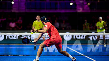 Alejandro Galán delivers a powerful shot during the Motorola Razr Miami Premier Padel P1 quarterfinals in 2025, showcasing his skill and intensity on the Miami court