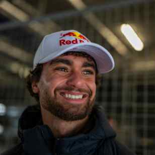Ultrarunner Arda Saatçi poses for a portrait in his Red Bull baseball cap.