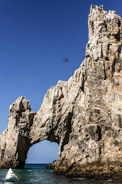 Jonathan Paredes launches from the arch of Cabo San Lucas in Mexico for Red Bull Cliff Diving World Series.