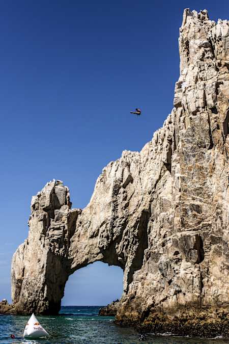 Jonathan Paredes launches from the arch of Cabo San Lucas in Mexico for Red Bull Cliff Diving World Series.