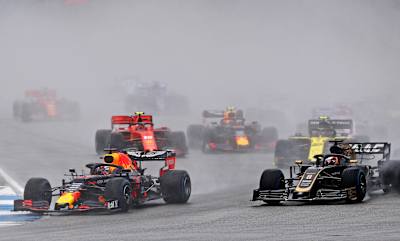 Max Verstappen of Aston Martin Red Bull Racing RB15 leads Romain Grosjean of Haas F1 Team VF-19 Ferrari on track during the F1 Grand Prix of Germany at Hockenheimring on July 28, 2019.