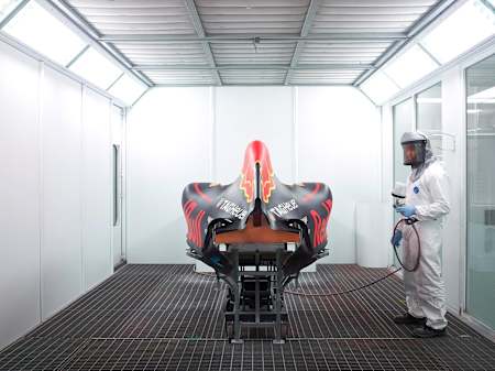 A Red Bull Racing F1 car is sprayed