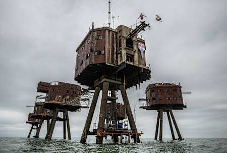 English divers Blake Aldridge (L) and Gary Hunt (R) dive from an 18 metre winching boom on the World War II Maunsell Forts in the Thames Estuary, England - September 2012