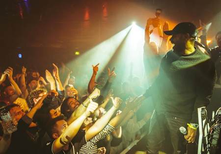 A photo of grime artist Kano live at London club Fabric.