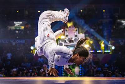 In 2024, B-Girl India performs an acrobatic breakdance move at the Red Bull BC One World Final event in Rio de Janeiro, Brazil