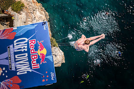 Molly Carlson cliff diving, seen from above.