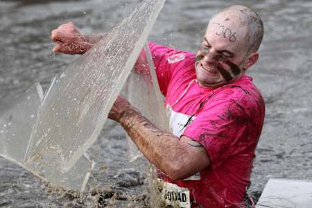 A competitor battling against the rough conditions at the Tough Guy Challenge.