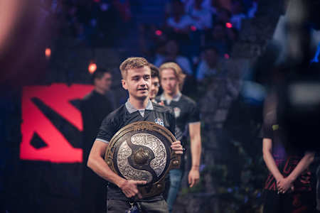 OG player N0tail carries the The International trophy at TI9 in Shanghai, China.