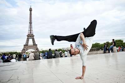 B-Boy dancer Lilou is pictured performing a freeze in front of the Eiffel Tower in Paris, France.