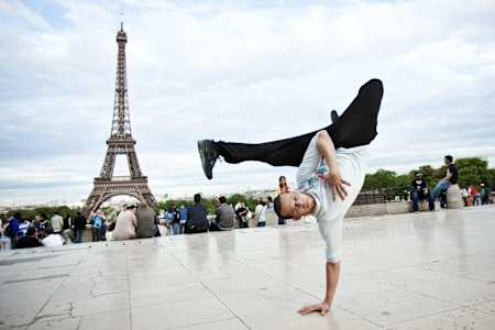 B-Boy dancer Lilou is pictured performing a freeze in front of the Eiffel Tower in Paris, France.