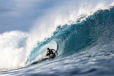 Molly Picklum rides the tube at Teahupo'o in Tahiti.