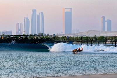 A surfer rides the tube at the Surf Abu Dhabi wave pool.