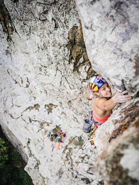 Sasha DiGiulian reaches for a hold during an expedition to summit the Pico Cão Grande volcanic peak on São Tomé island.