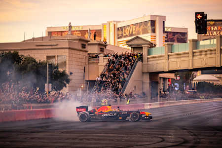 Spectators watch as Sergio Pérez drives at the Las Vegas Grand Prix Launch Party in November 2022.