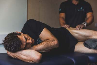 Gee Atherton receiving a massage to his leg.