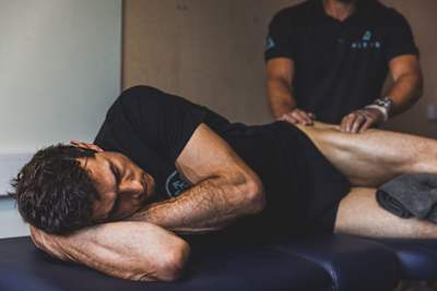 Gee Atherton receiving a massage to his leg.